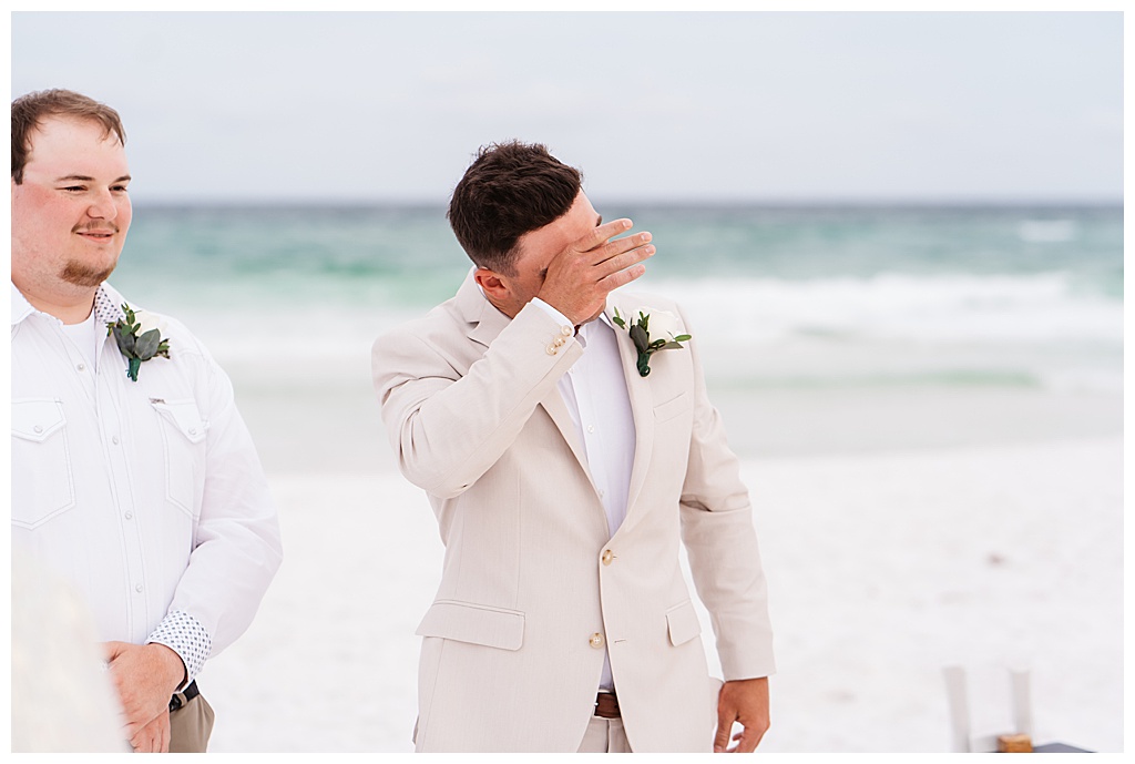 Groom's reaction to seeing bride walk down the aisle