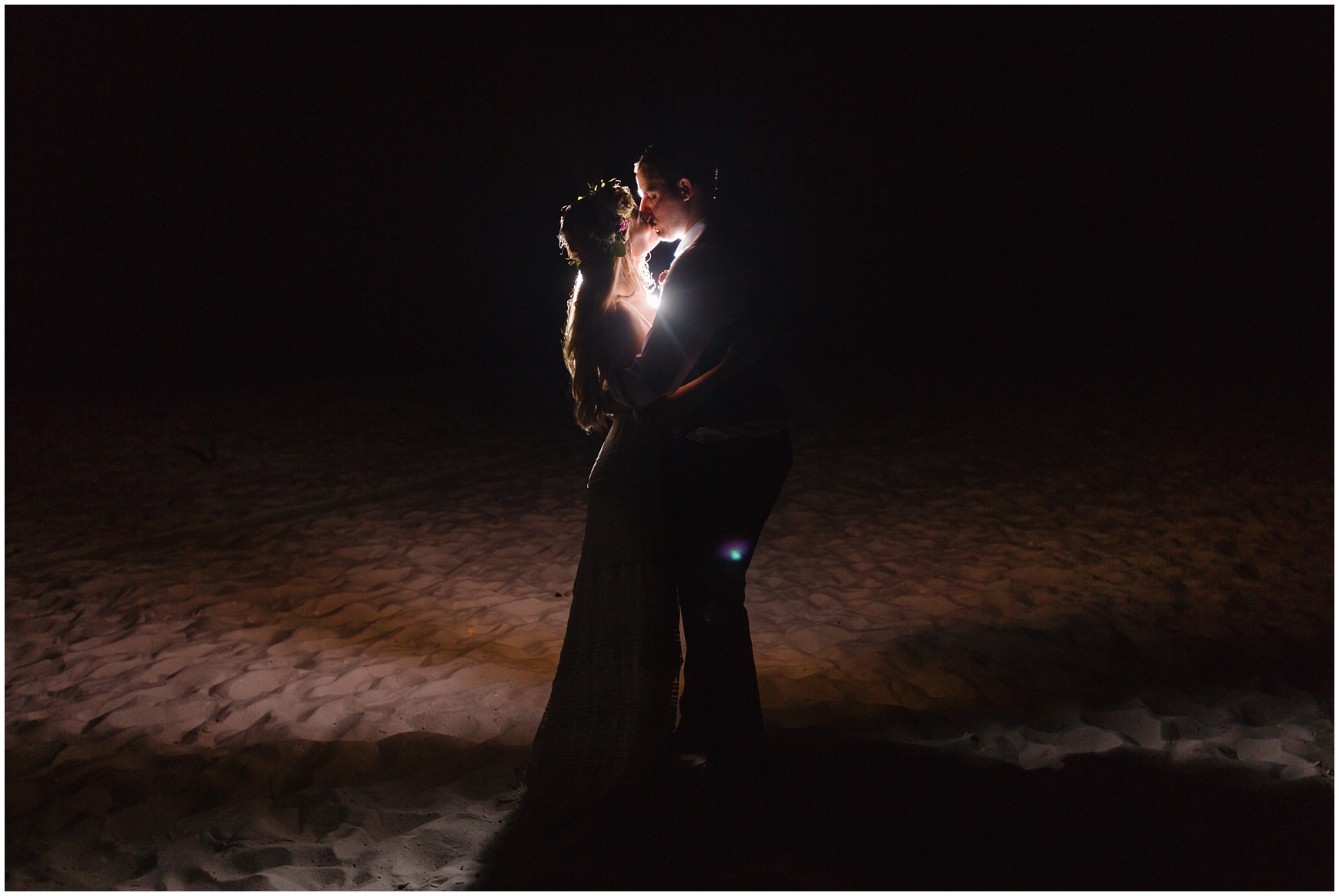 Bride and Groom night portrait on the beach