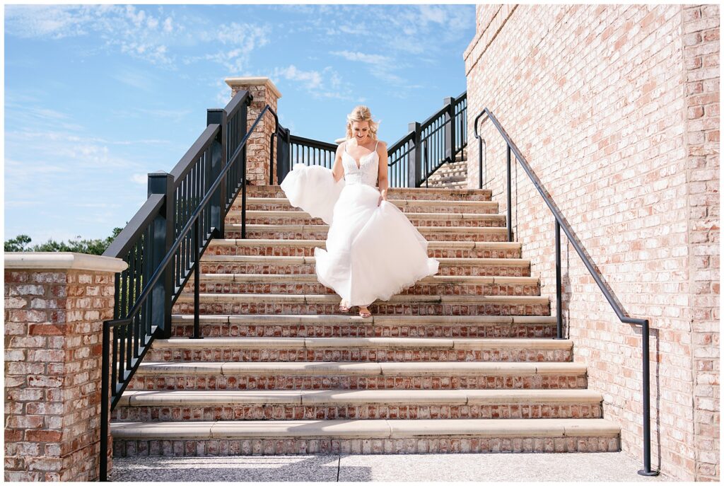 Bride walking down steps at henderson beach resort