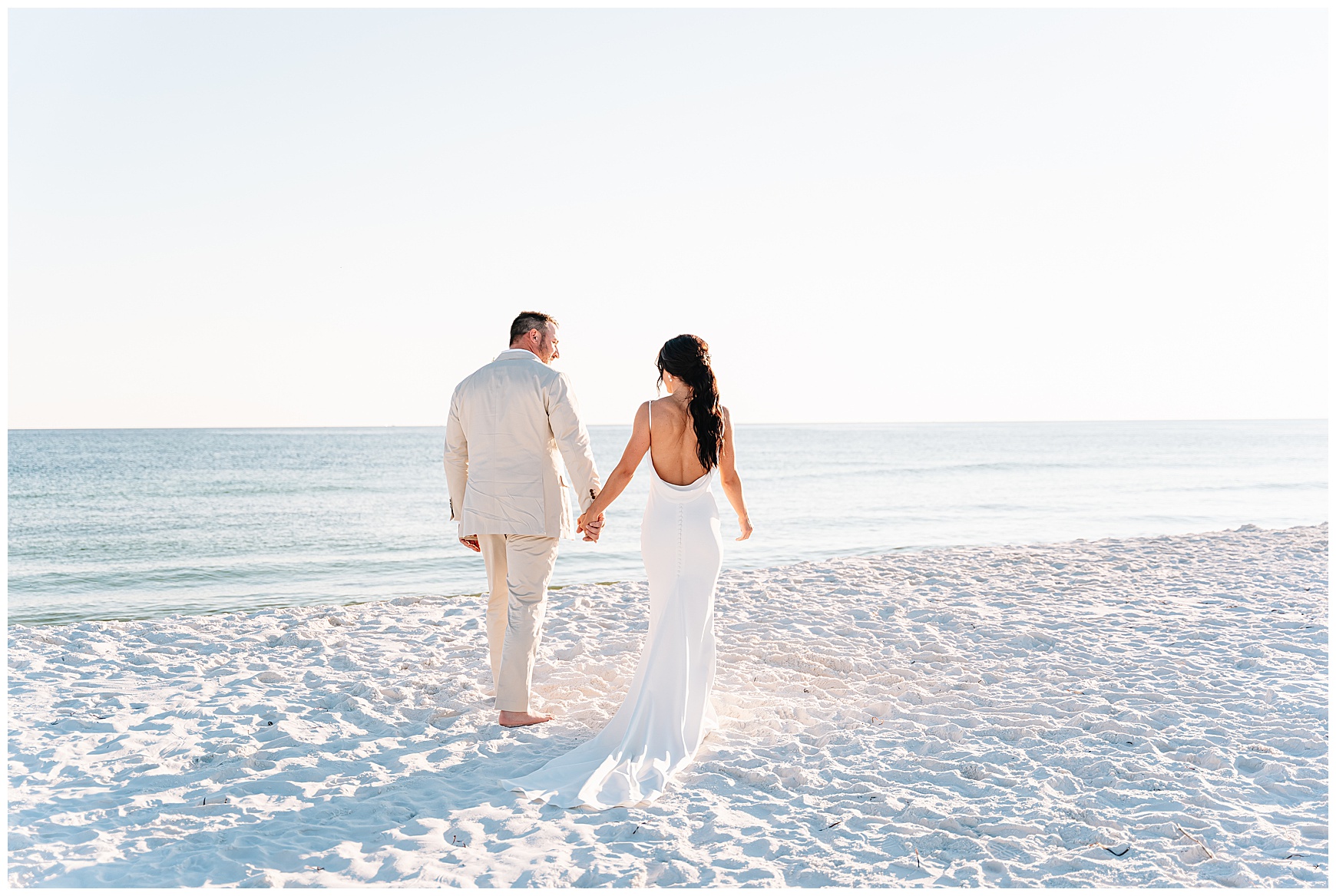 Bride and Groom walking on the beach in destin, fl